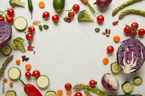 Tableau sur toile Flay lay with vegetables and seeds on white surface