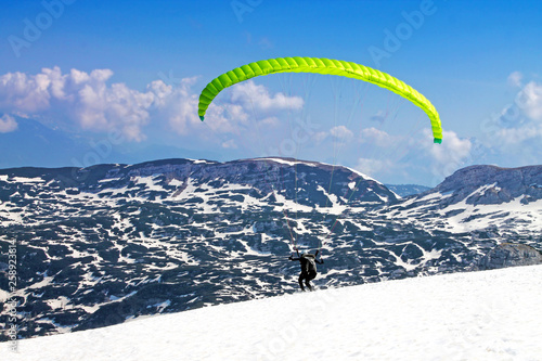 Hang - glider in Austrian Alps taken in winter. 