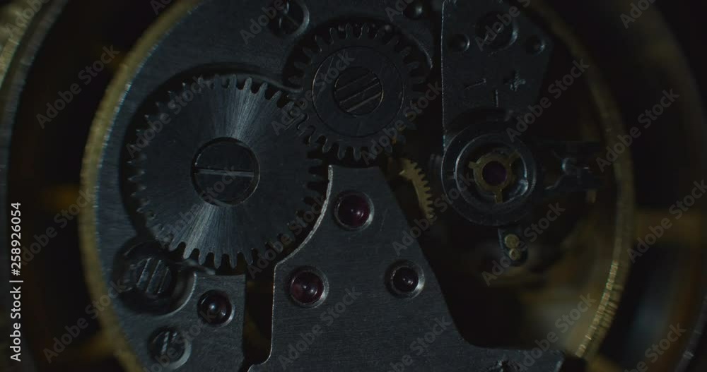 Old clock mechanical part working white lightning mooving from left side static ProRes 4444 Old clock mechanical part working white lightning mooving from left side static ProRes 4444