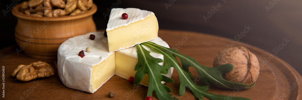 Cheese camembert or brie with walnuts and arugula