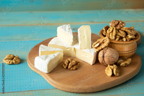 Cheese camembert or brie with walnut kernels