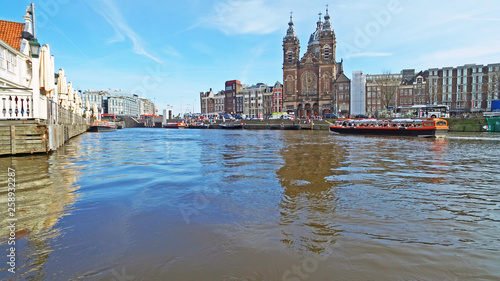 Canvas Print View on the city Amsterdam with the Nicolaas church in the Netherlands