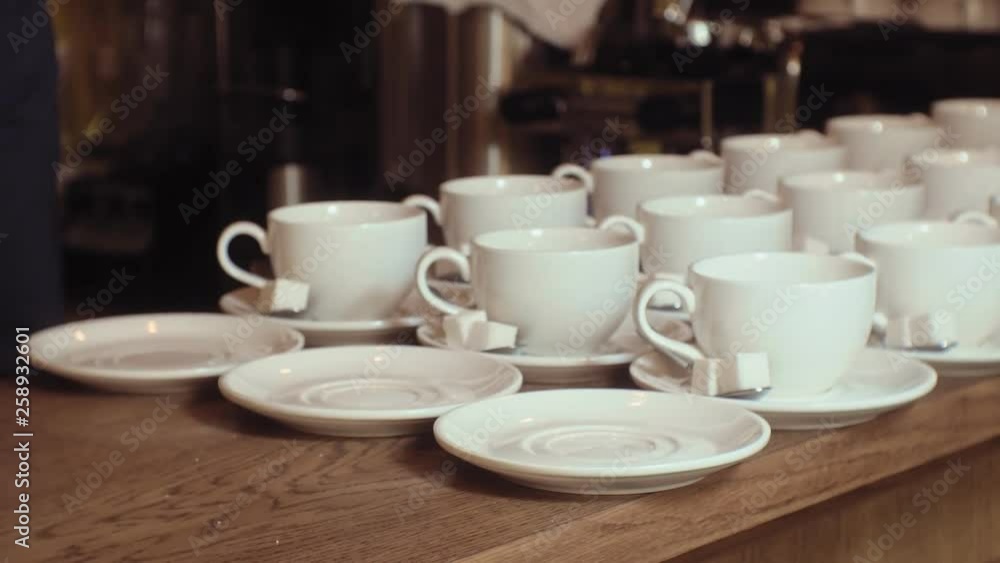 many empty white clean tea cups many empty white clean tea cups