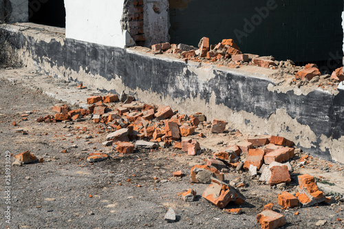 Ruined wall with broken bricks