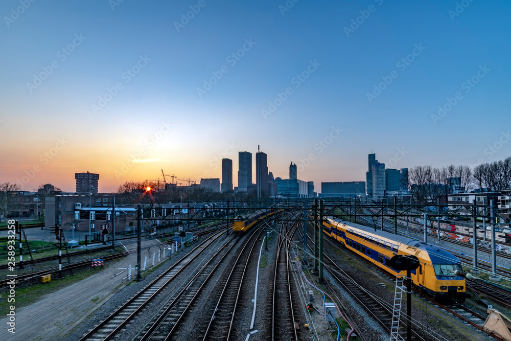 The Hague (Den Haag in Dutch) skyline during the sunset moment behind the train station