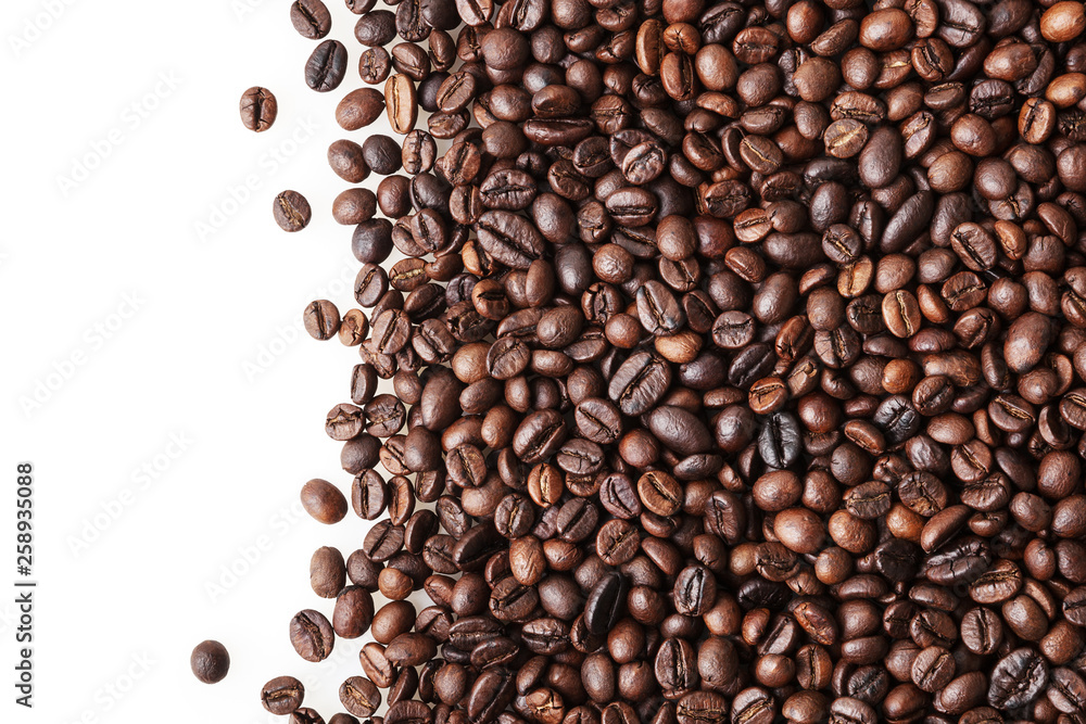 Roasted coffee beans on white background with copy space Roasted coffee beans on white background with copy space