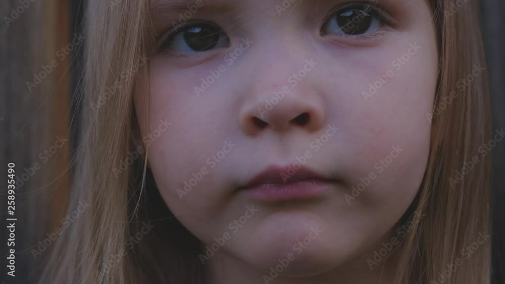 Close-up portrait of a beautiful little girl posing outdoors Close-up portrait of a beautiful little girl posing outdoors