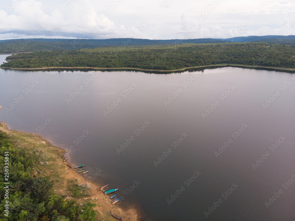 Drone shot Aerial view landscape scenic of big river reservoir with nature forest and mountains in tropical land Drone shot Aerial view landscape scenic of big river reservoir with nature forest and mountains in tropical land