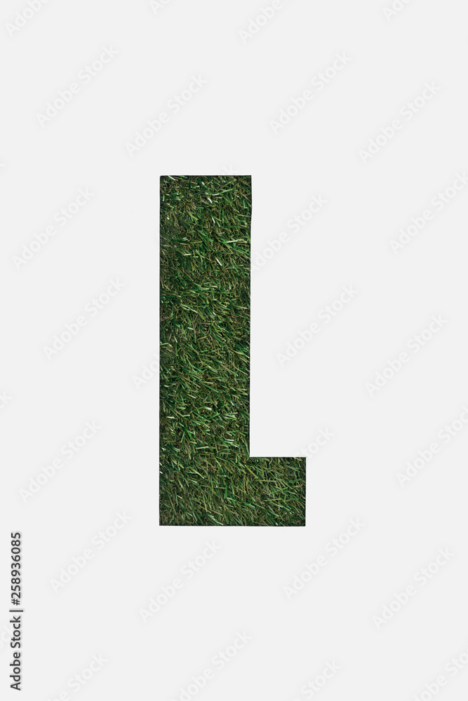 top view of cut out L letter on green grass background isolated on white top view of cut out L letter on green grass background isolated on white