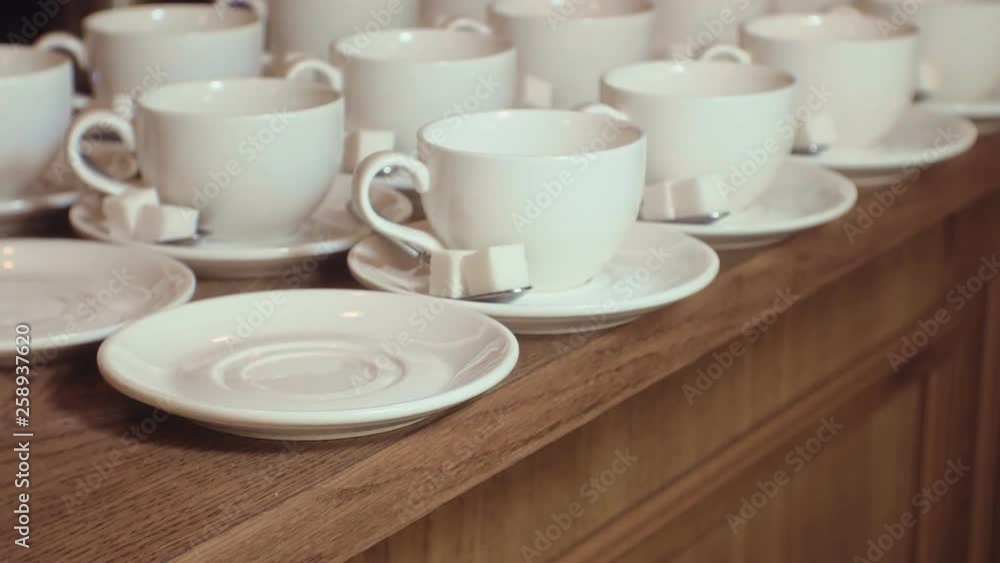 many empty white clean tea cups many empty white clean tea cups