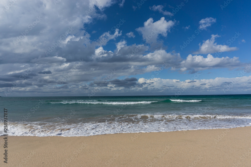 waves in the ocean and blue sky