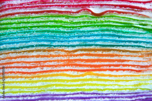 Close-up of colorful rainbow crepe cake layers 