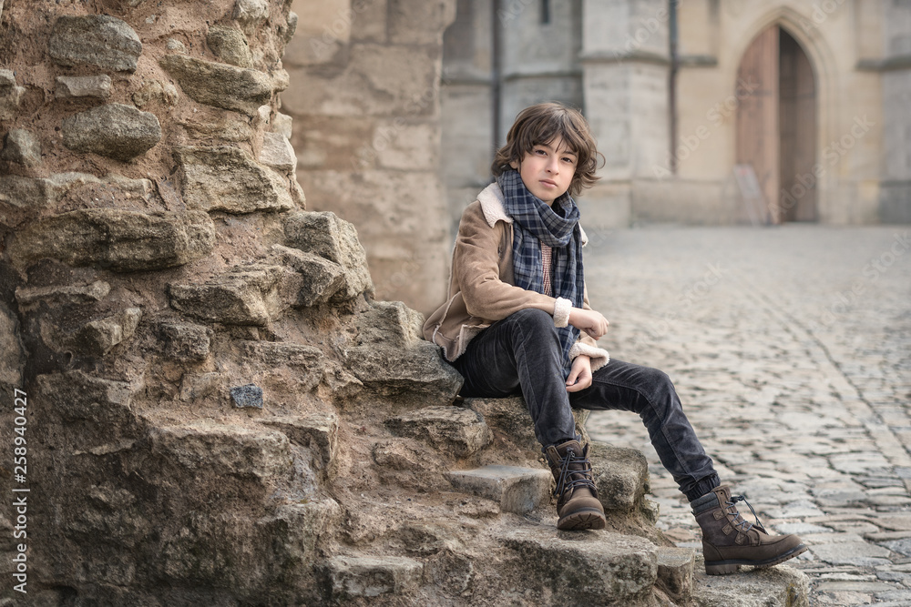 Portrait of a handsome and fashionable boy in autumn clothes. Portrait of a handsome and fashionable boy in autumn clothes.
