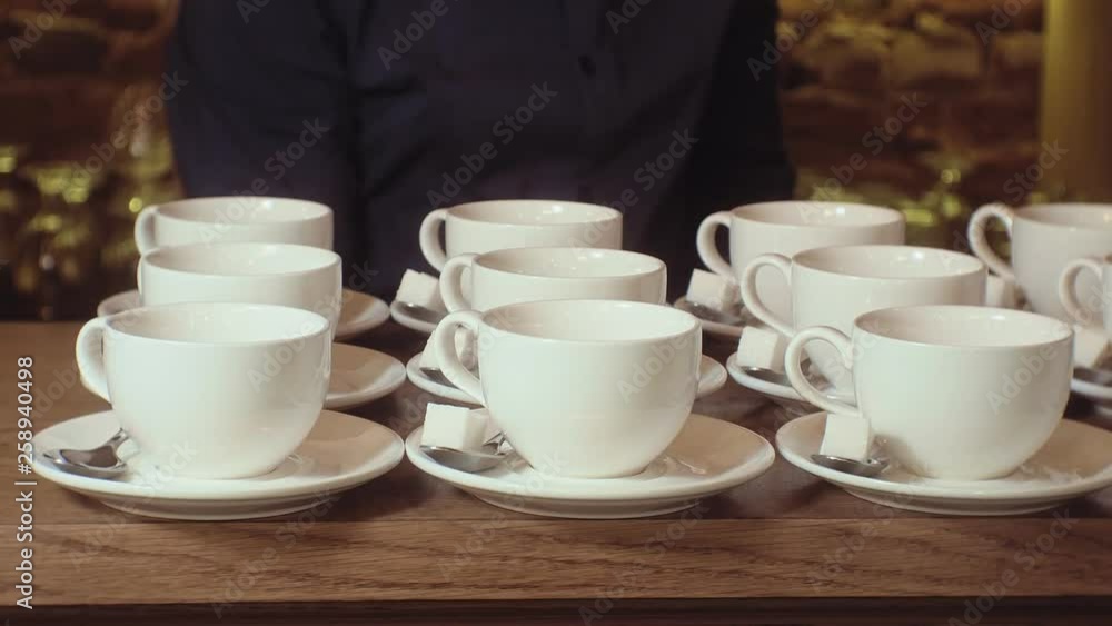 many empty white clean tea cups many empty white clean tea cups