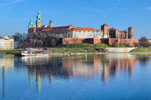 Wawel Hill with Wawel Royal Castle and Wawel Cathedral in Krakow, Poland. View from Debnicki bridge across Vistula river.
