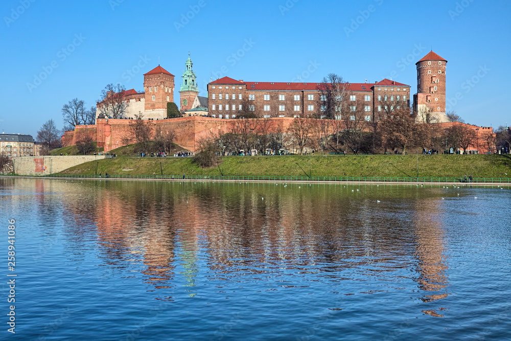 Wawel Hill with Wawel Royal Castle and Wawel Cathedral in Krakow, Poland. View from the bank of Vistula river.