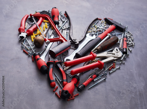 Heart shaped arrangement of assorted hand tools photo