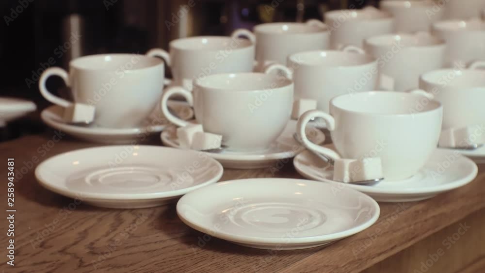 many empty white clean tea cups many empty white clean tea cups