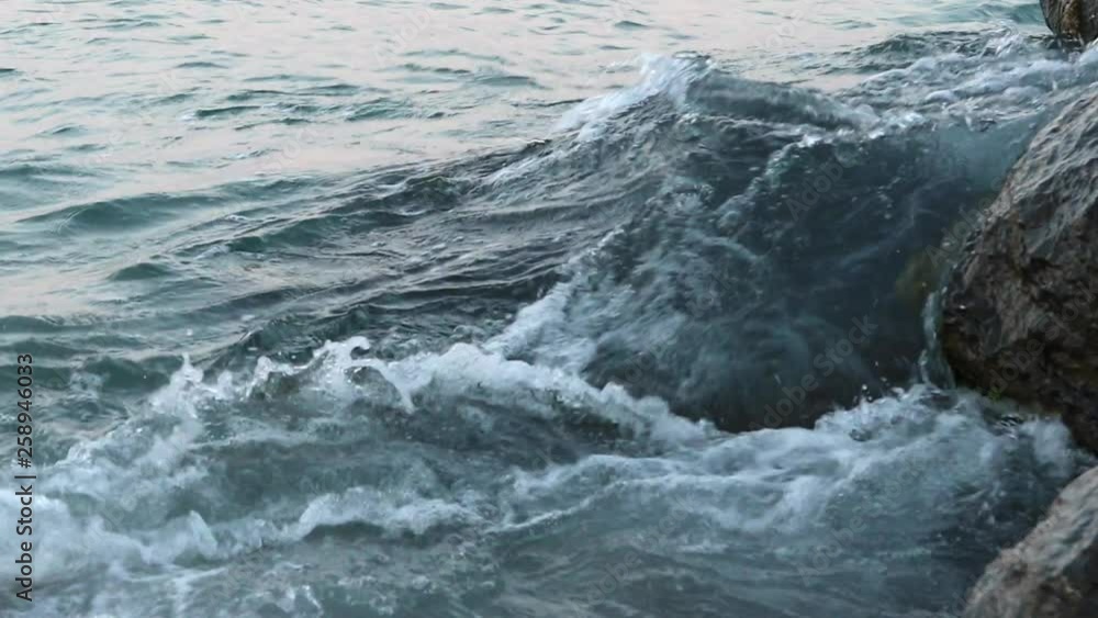 Gentle waves sea. Sand on beach on Costa Brava in Spain Gentle waves sea. Sand on beach on Costa Brava in Spain