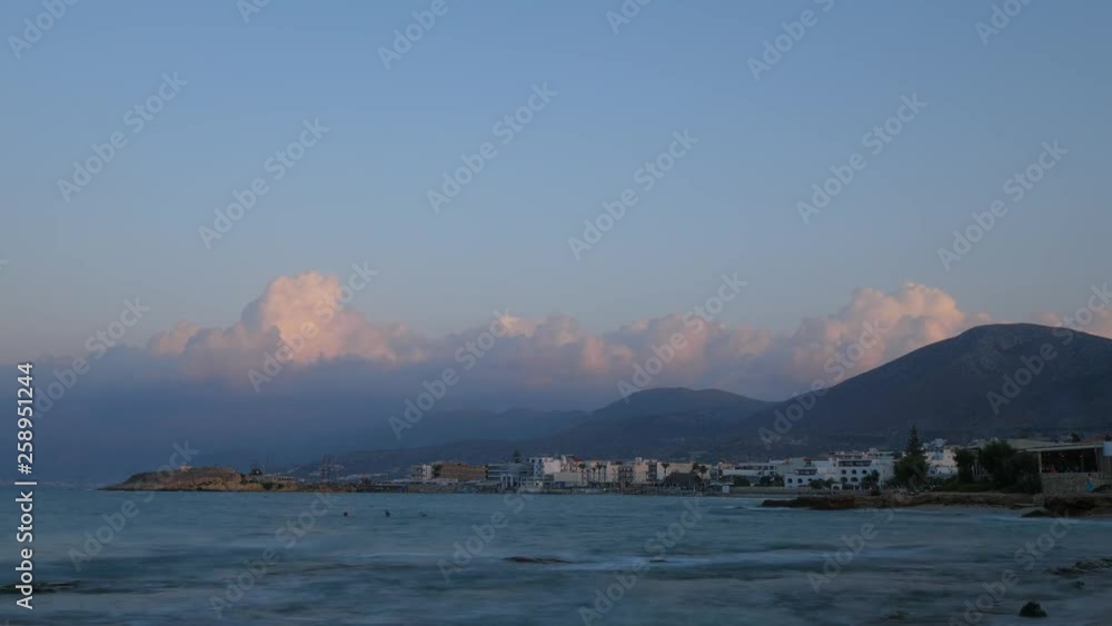 Time lapse shot of sea coast at Hersonissos town after sunset Time lapse shot of sea coast at Hersonissos town after sunset