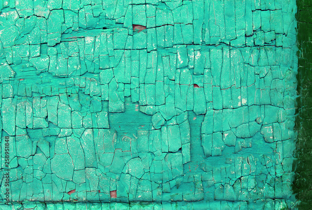 Obraz premium Old wooden background with remains of pieces of scraps of old paint on wood. Texture of an old tree, vintage wood background peeling paint. old blue board with cracked paint