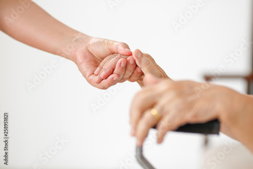 Wallpaper Mural Elderly asian woman using a cane at home with caregiver take care Torontodigital.ca