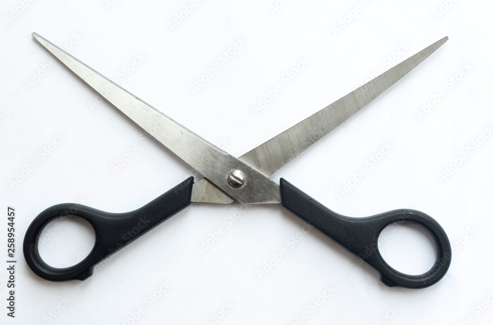 A pair of sharp metal cutting scissors with the cutting blades