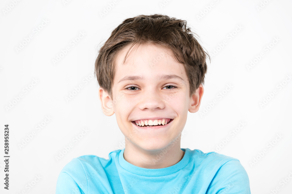 Portrait of an emotional boy on a white background. Portrait of an emotional boy on a white background.