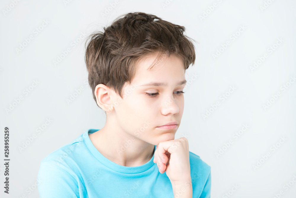 Portrait of an emotional boy on a white background. Portrait of an emotional boy on a white background.