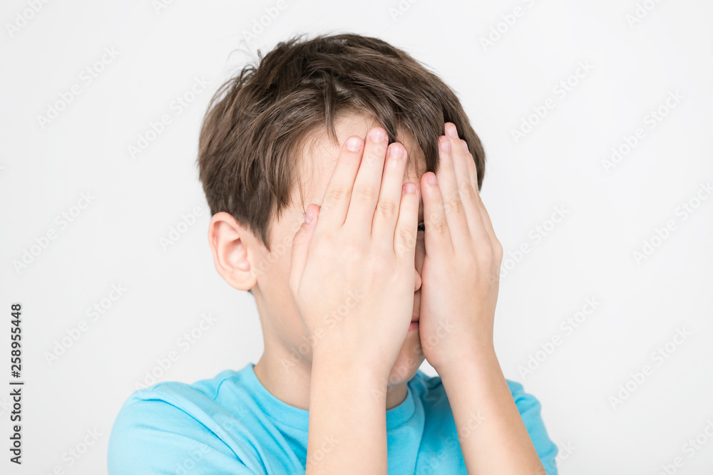 Portrait of an emotional boy on a white background. Portrait of an emotional boy on a white background.