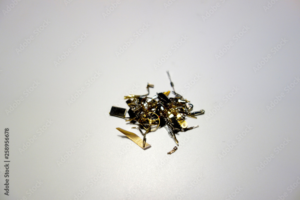 Gilded electronic and mechanical waste Gilded electronic and mechanical waste