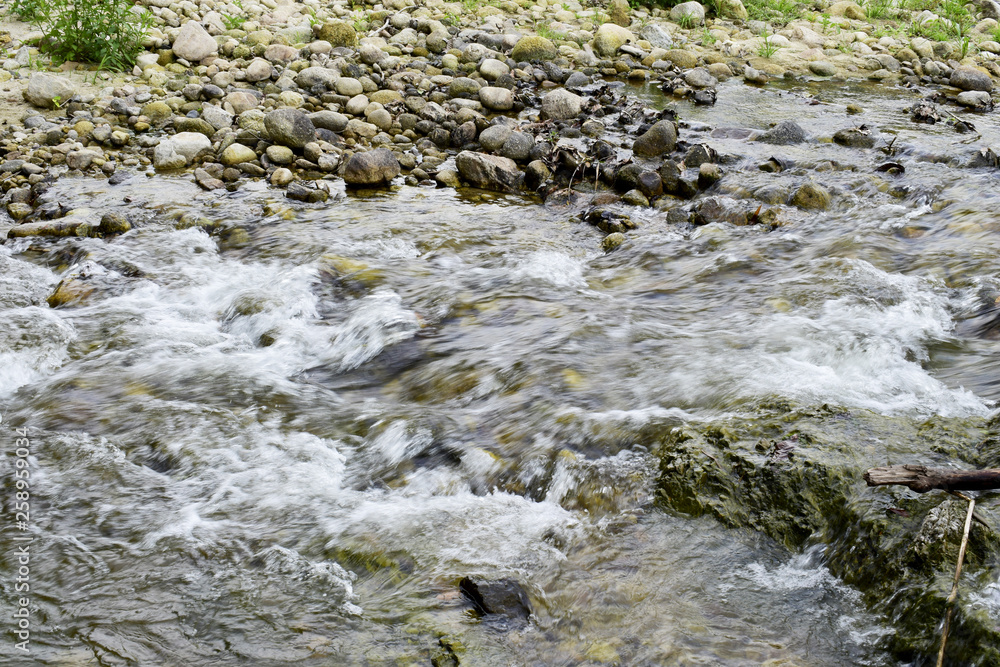 Canal landscape with water flowing through rocks Canal landscape with water flowing through rocks
