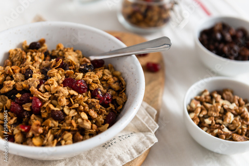 Dry breakfast cereals. Crunchy honey granola bowl with flax seeds, cranberries and coconut. Healthy and fiber food. Breakfast time. Dieting
