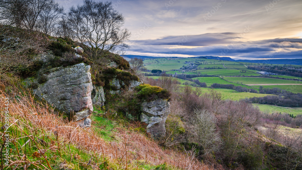 Corby's Crag above Edlingham, overlooking the hamlet of Edlingham in Northumberland, England and is popular with rock climbers Corby's Crag above Edlingham, overlooking the hamlet of Edlingham in Northumberland, England and is popular with rock climbers