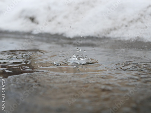 Polonne / Ukraine - 31 January 2019: Close up on water drop with water wave