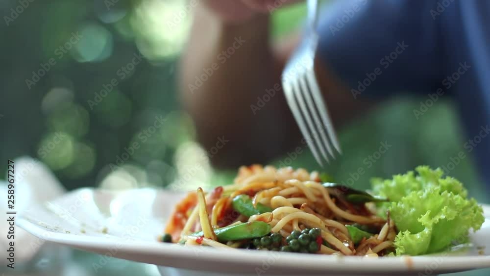 man eating hot and spicy spaghetti seafood man eating hot and spicy spaghetti seafood