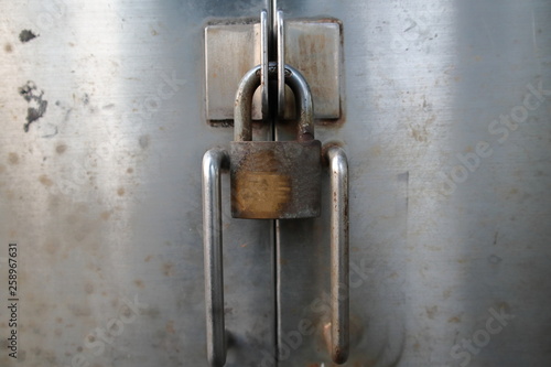 Padlock locked the door. © Voranut
