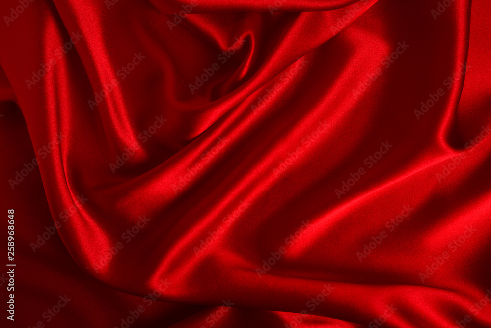 Obraz premium Red silk or satin luxury fabric texture can use as abstract background. Top view.
