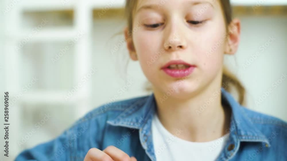 portrait of little girl playing online games on tablet portrait of little girl playing online games on tablet