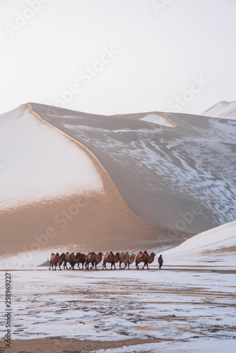 Dunhuang ,  China :  The Silk road - Mingsha sand mountain (Gobi desert) with snow covered in the early winter