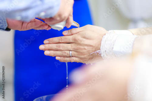 Hands pouring blessing water in wedding thailand