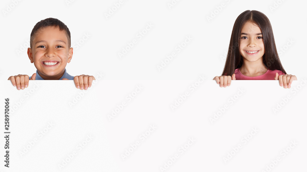Kids holding blank advertising board, copy space Kids holding blank advertising board, copy space