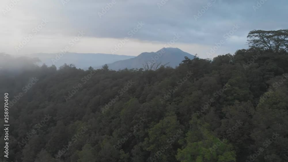 Aerial view of mount Batur in the evening with the evaporation of clouds. Aerial view of mount Batur in the evening with the evaporation of clouds.
