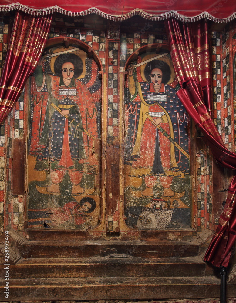 Fototapeta premium TIGRAY, ETHIOPIA - February 25, 2019: iconographic scenes and wall murals of saints painted in Selassie Chelokot church