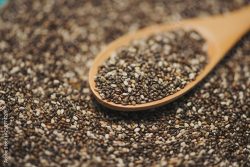 Close-up of ealthy chia seeds in a spoon. Text space.