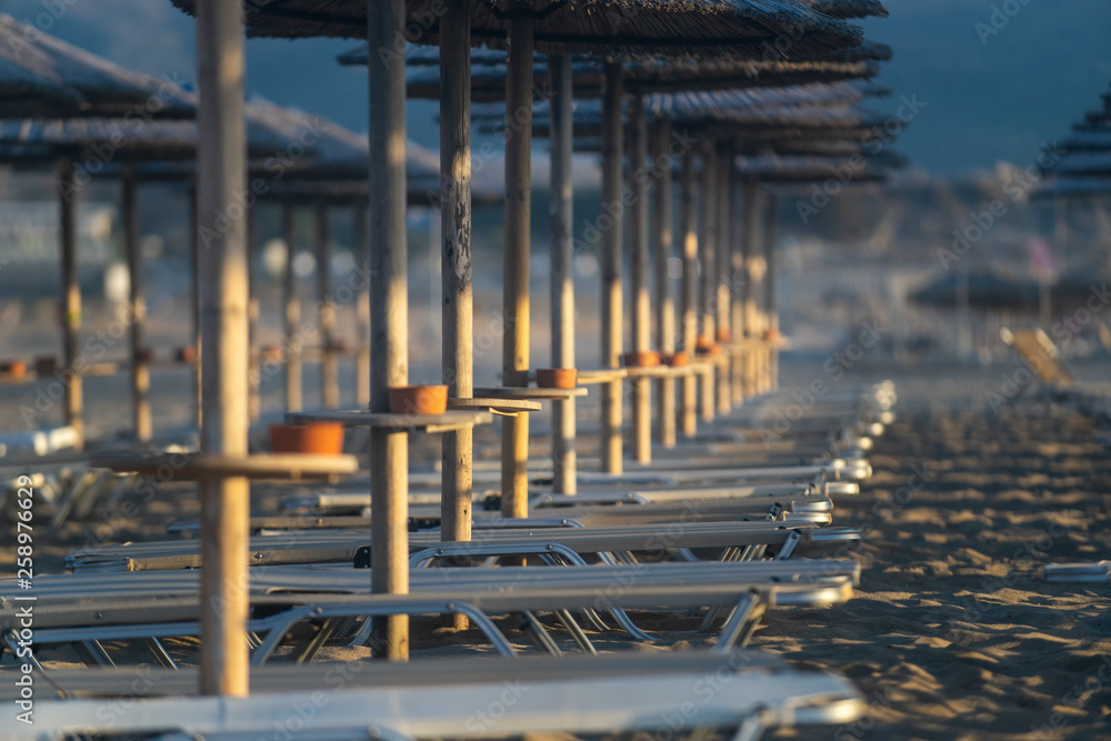 Bamboo, reed, straw beach umbrellas on the beach Falasarne, Greece, Crete