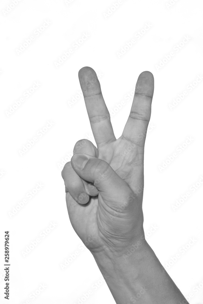 Hand showing peacy victory sign against pure. black and white. Hand showing peacy victory sign against pure. black and white.