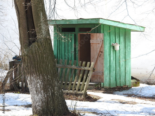 two rural Outback wooden Toilets in winter park. photo