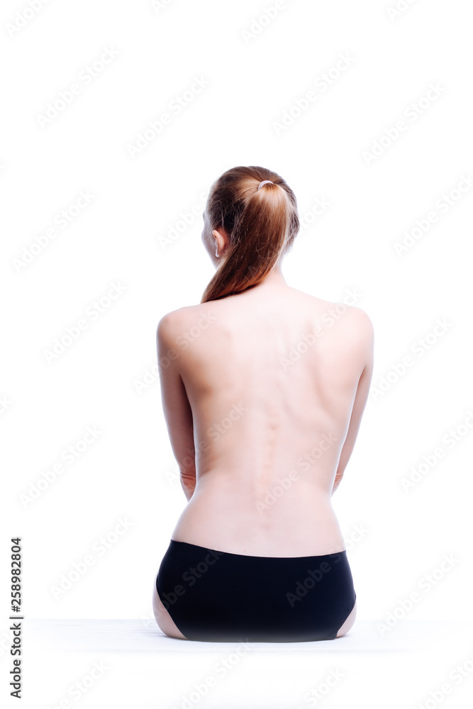 Obraz premium Back of beautiful nude woman on white background