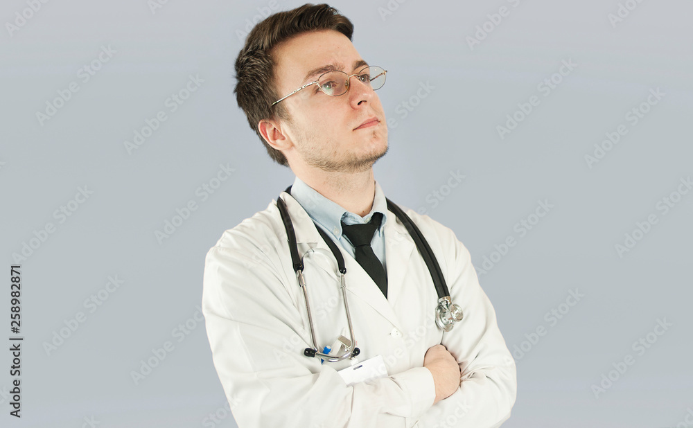Doctor senior man, medical professional holding something in empty hand isolated over blue background Doctor senior man, medical professional holding something in empty hand isolated over blue background